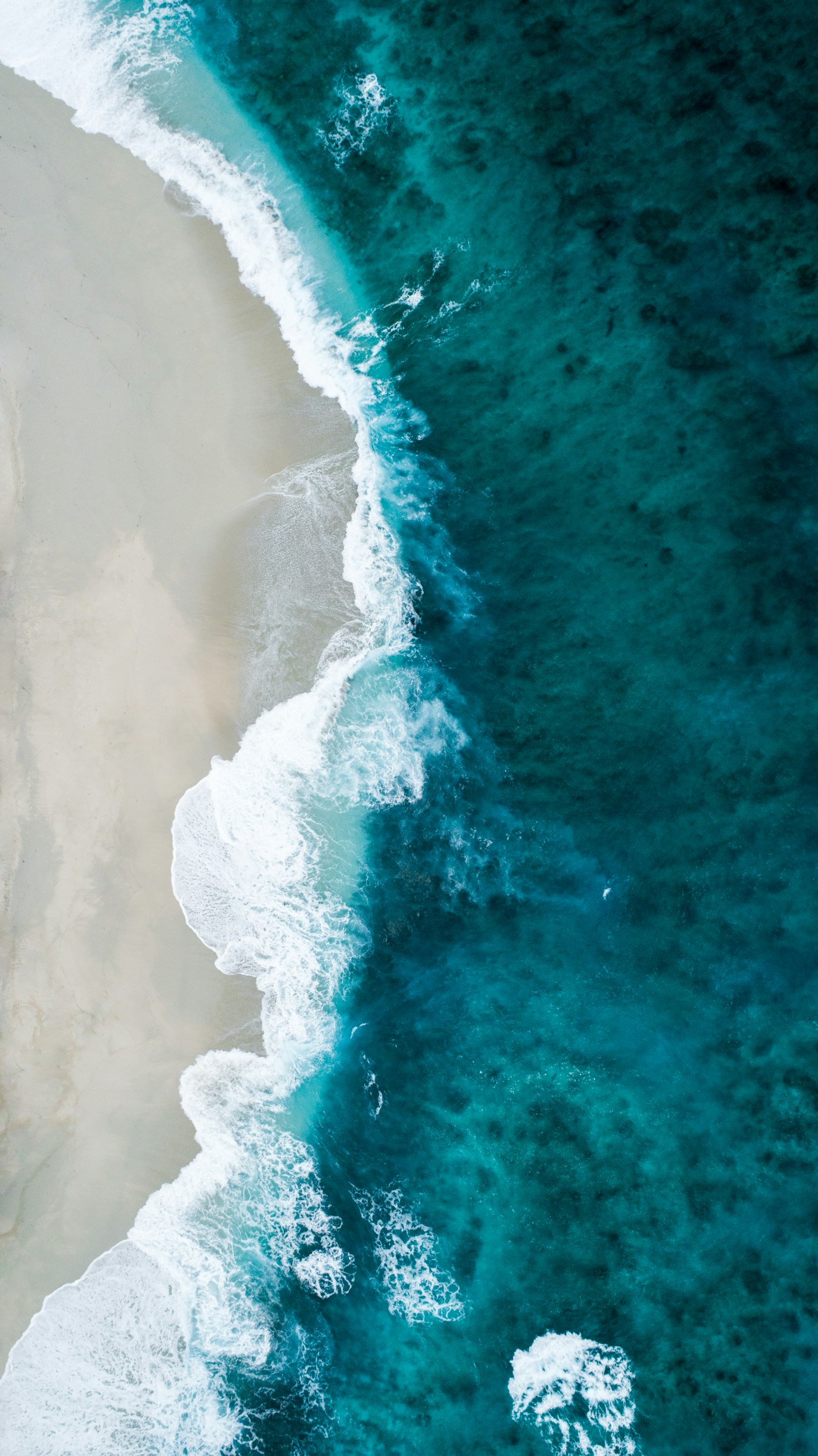 Perfect turquoise wave peeling across the pool