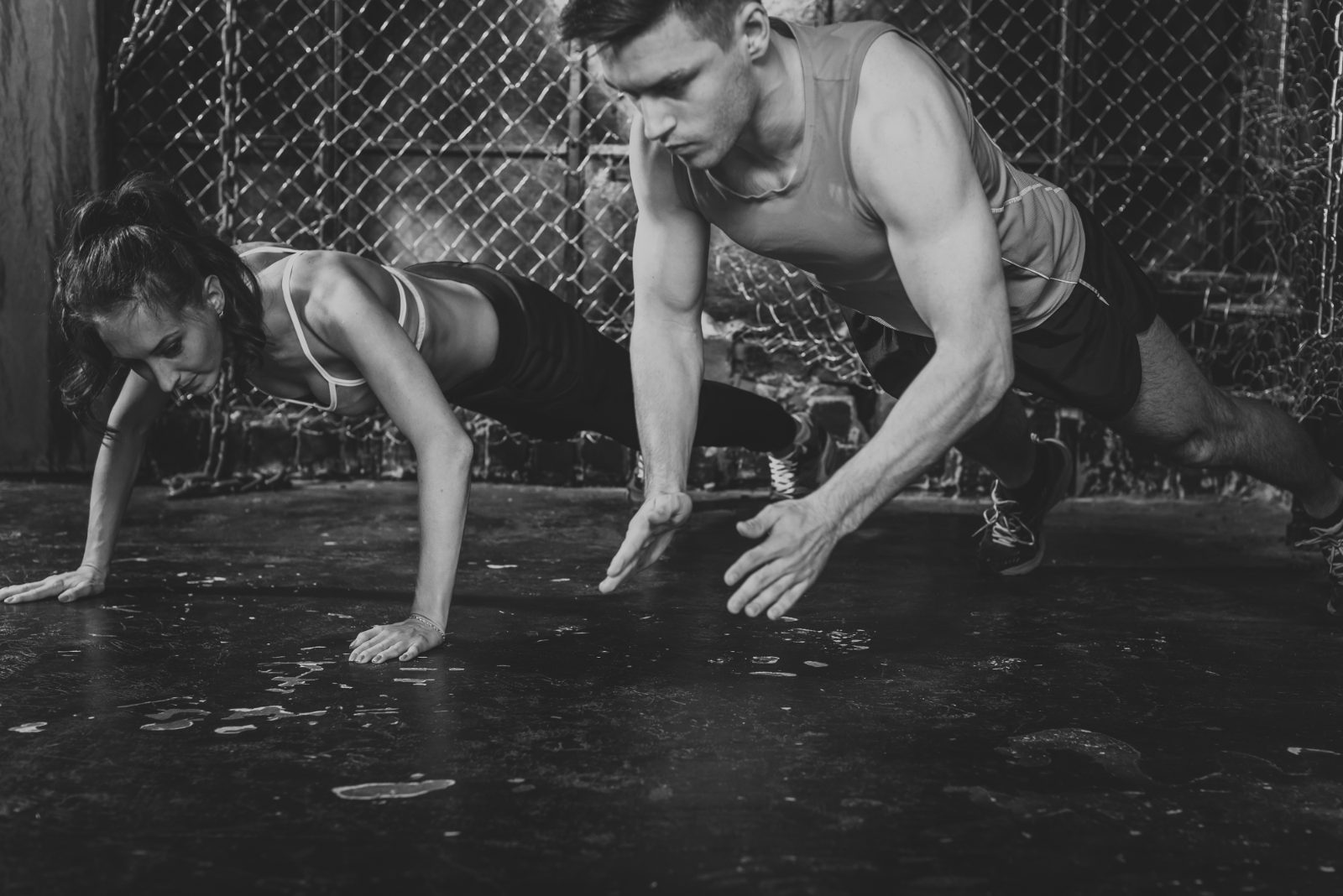 Two athletes doing push-ups during a functional training session